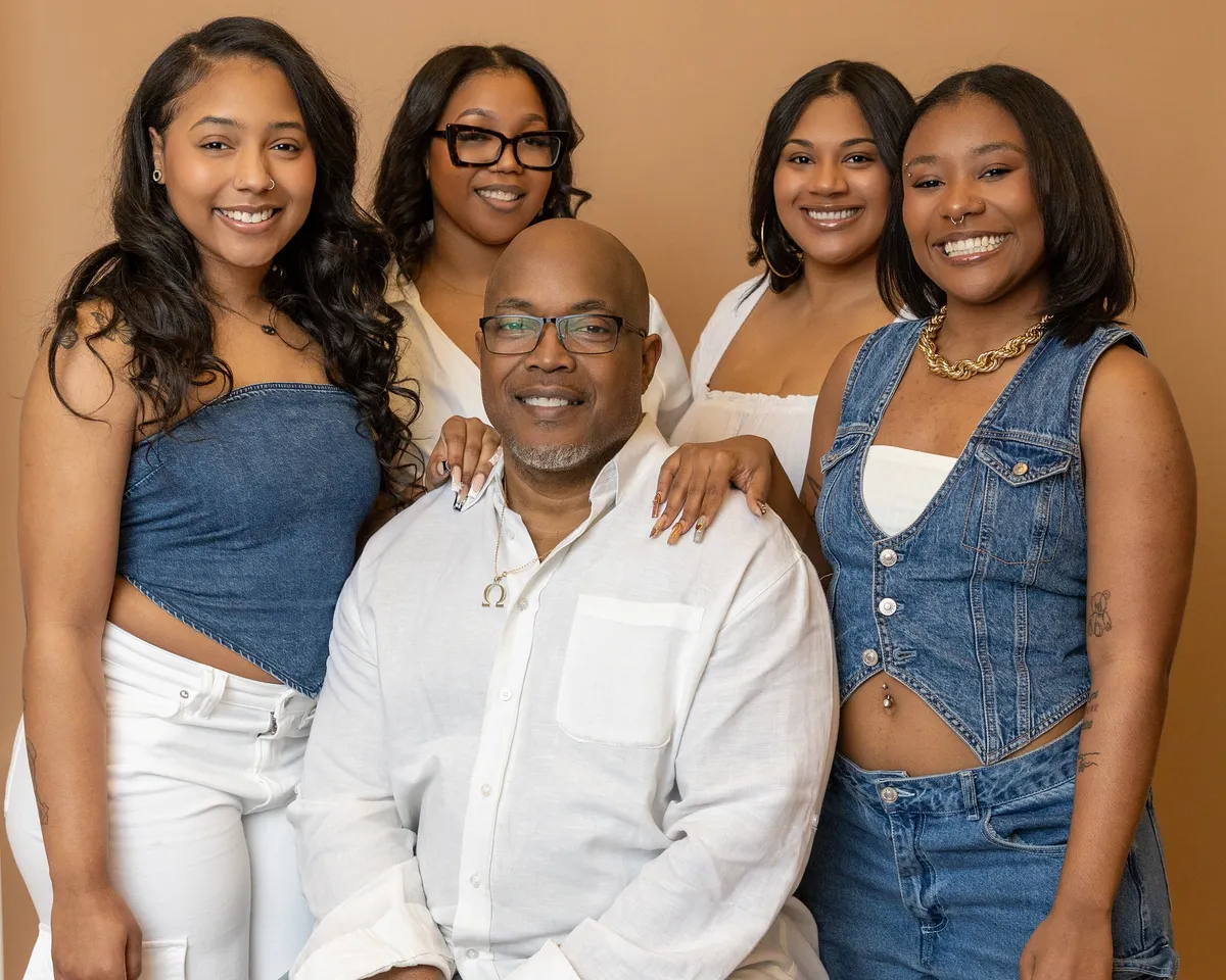 Studio family portrait with coordinated outfits