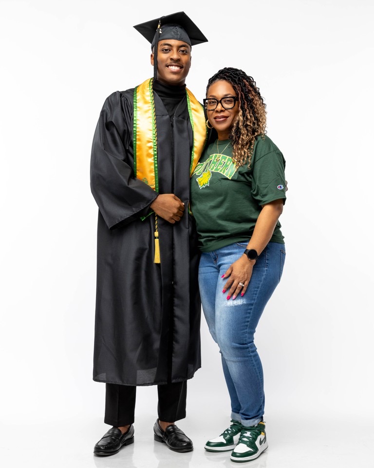 Graduate celebrating with proud mother