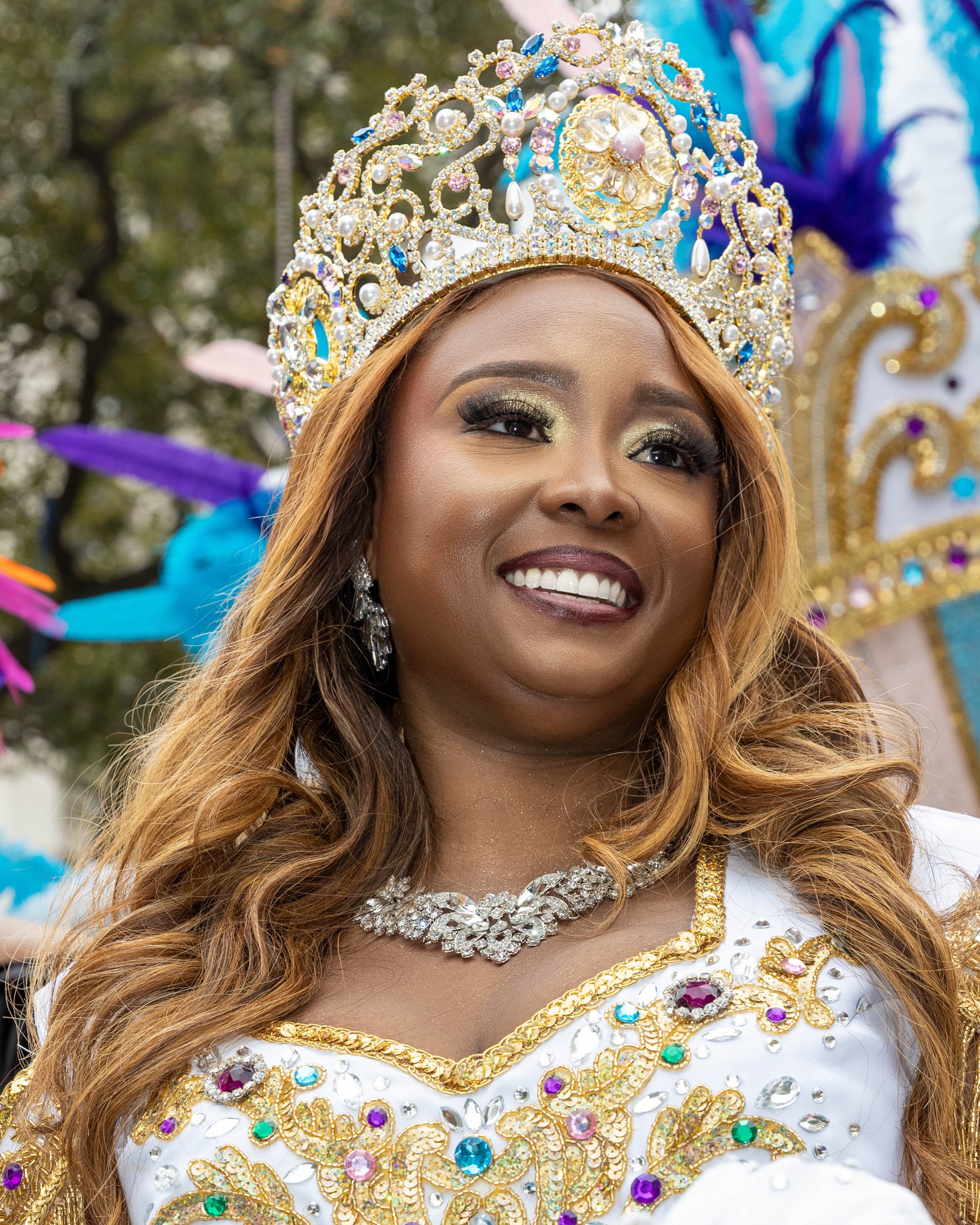 Mardi Gras queen with ornate crown and costume